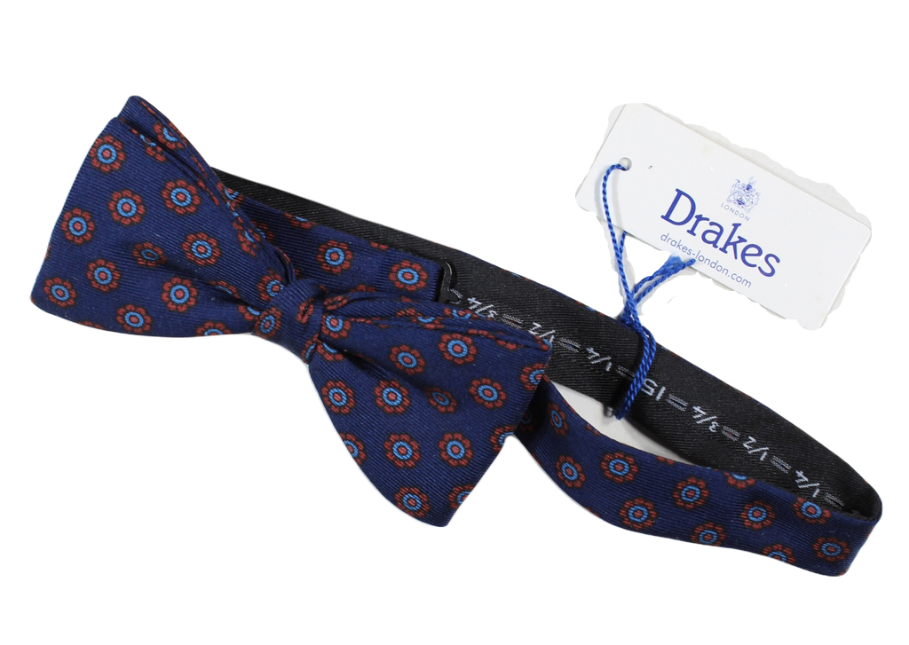 Drake's – Navy Silk Bowtie w/Blue & Orange Ancient Madder Print